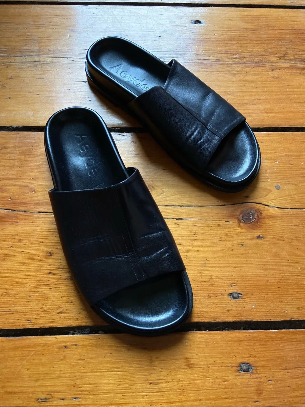 Aeyde black nappa leather slides